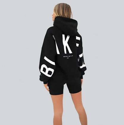 SUDADERA OVERSIZE CON CAPUCHA Y ESTAMPADO GRÁFICO TRASERO - Ada Cepeda Shop